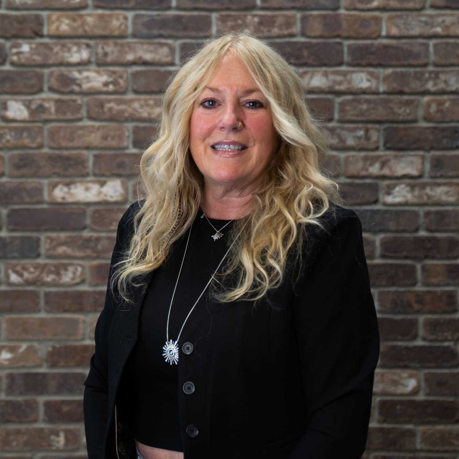 Portrait of Kathie, a professional stylist at One83 Mane Studio, showcasing their expertise and style.