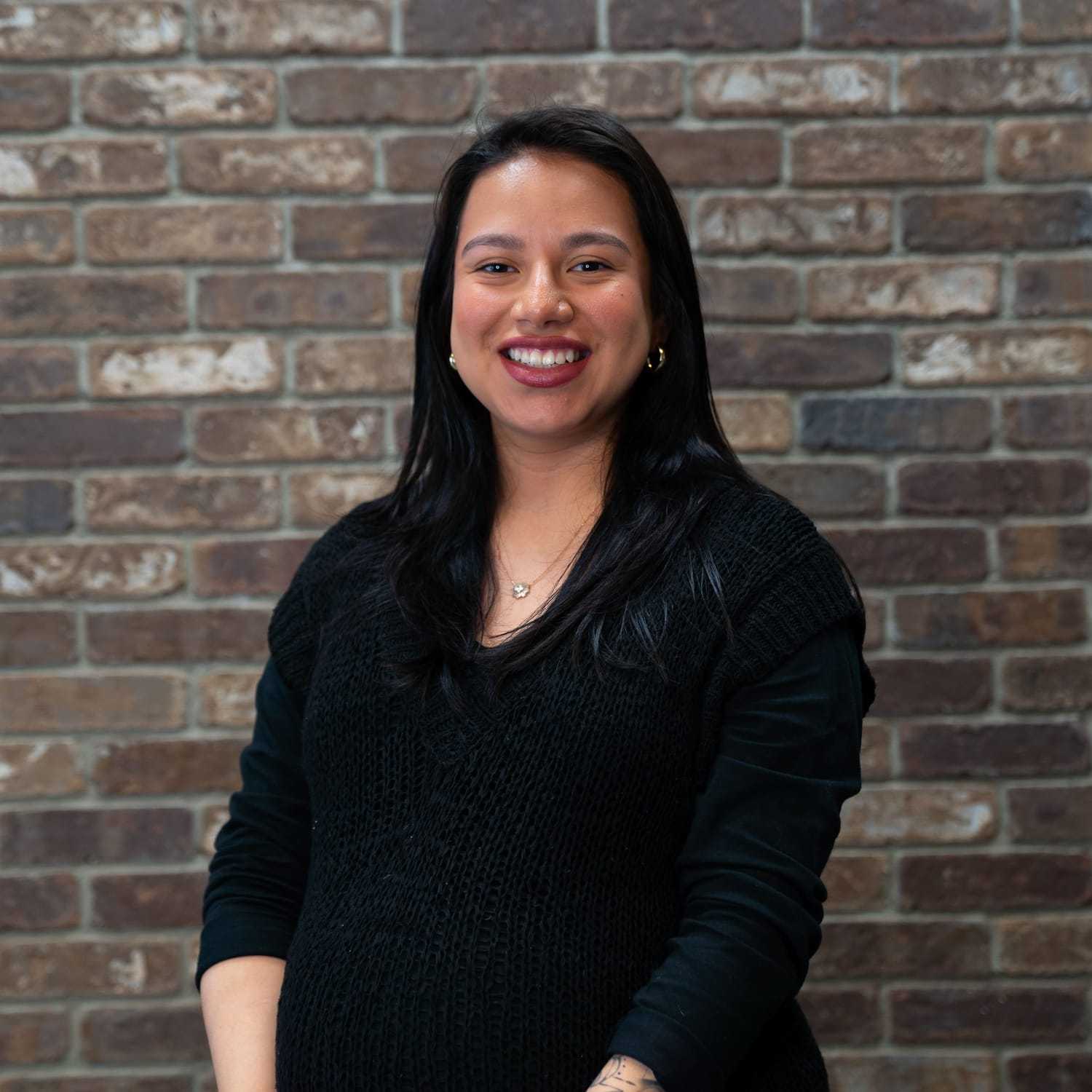 Portrait of Arlene, a professional stylist at One83 Mane Studio, showcasing their expertise and style.