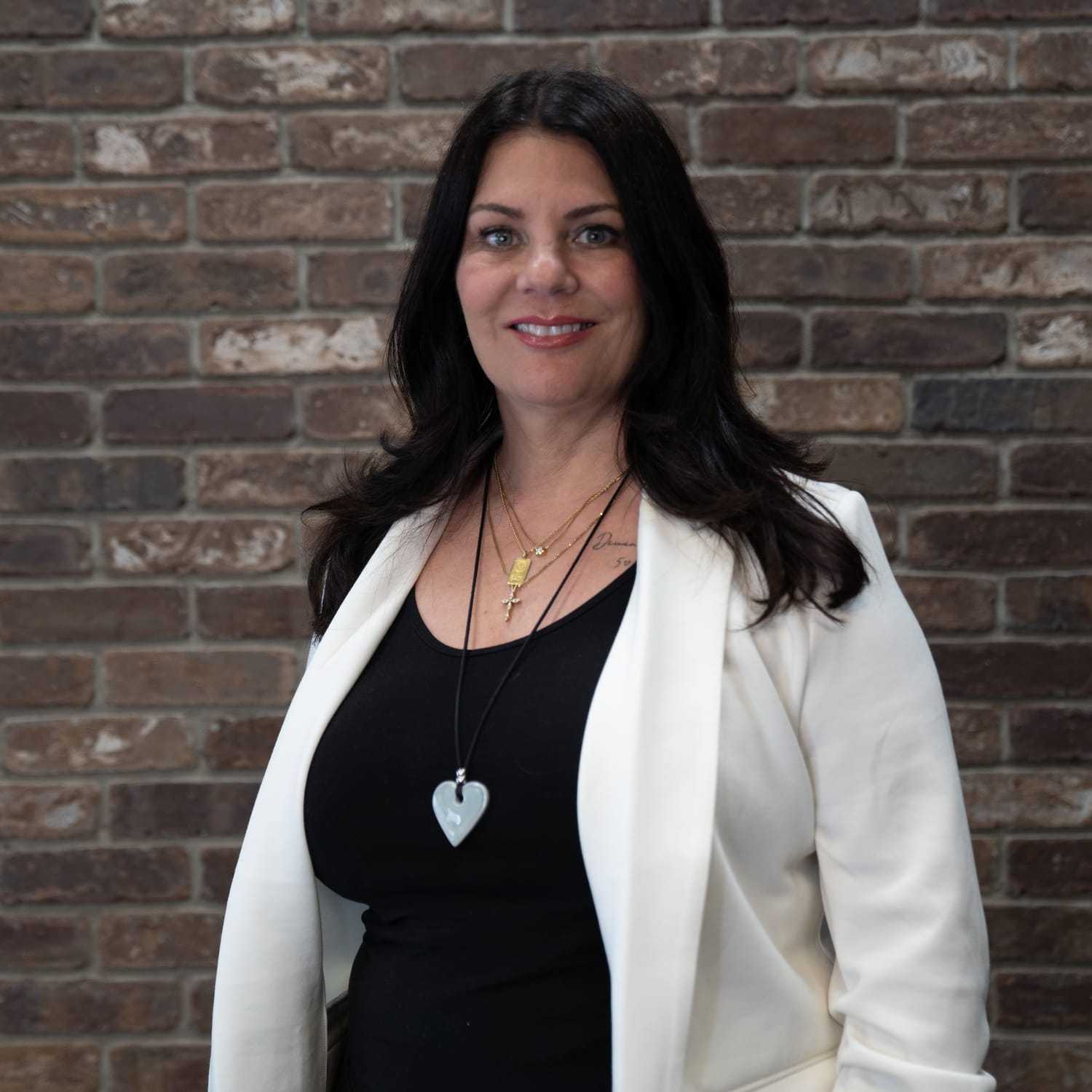 Portrait of Liliana, a professional stylist at One83 Mane Studio, showcasing their expertise and style.