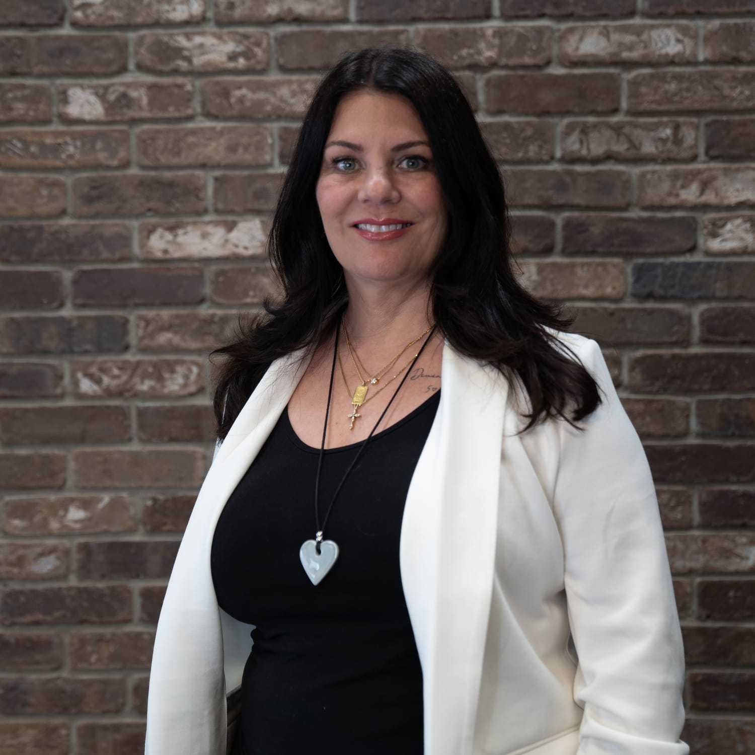 Portrait of Liliana, a professional stylist at One83 Mane Studio, showcasing their expertise and style.