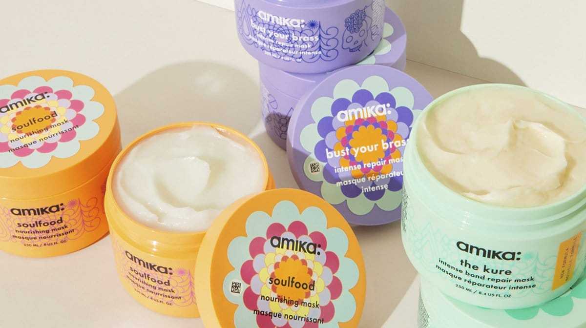 Brightly colored Amika hair masks in various flavors on display.